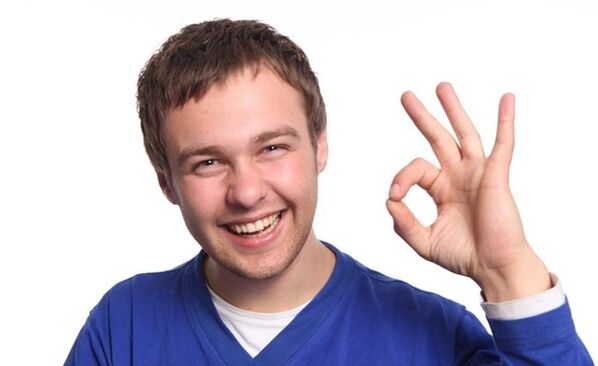 A man is happy to enlarge his penis with a vacuum expander